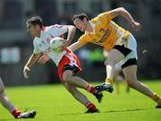 19 July 2009; Philip Jordan, Tyrone, in action against Niall McKeever, Antrim. GAA Football Ulster Senior Championship Final, Tyrone v Antrim, St Tighearnach's Park, Clones, Co. Monaghan. Picture credit: Brian Lawless / SPORTSFILE