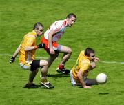19 July 2009; Stephen O'Neill, Tyrone, in action against Colm Brady, left, Andy McClean, Antrim. GAA Football Ulster Senior Championship Final, Tyrone v Antrim, St Tighearnach's Park, Clones, Co. Monaghan. Picture credit: Michael Cullen / SPORTSFILE