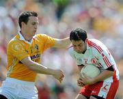 19 July 2009; Davy Harte, Tyrone, in action against Michael McCann, Antrim. GAA Football Ulster Senior Championship Final, Tyrone v Antrim, St Tighearnach's Park, Clones, Co. Monaghan. Picture credit: Brian Lawless / SPORTSFILE