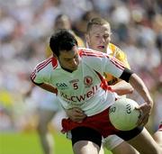 19 July 2009; Davy Harte, Tyrone, in action against Paddy Cunningham, Antrim. GAA Football Ulster Senior Championship Final, Tyrone v Antrim, St Tighearnach's Park, Clones, Co. Monaghan. Picture credit: Oliver McVeigh / SPORTSFILE