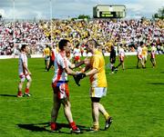 19 July 2009; Ryan McMenamin shakes hands with Colin Brady, Antrim. GAA Football Ulster Senior Championship Final, Tyrone v Antrim, St Tighearnach's Park, Clones, Co. Monaghan. Picture credit: Michael Cullen / SPORTSFILE
