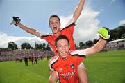 19 July 2009; Armagh's James Morgan carries team-mate Robbie Tasker in celebration. ESB Ulster Minor Football Championship Final, Armagh v Down, St Tighearnach's Park, Clones, Co. Monaghan. Picture credit: Brian Lawless / SPORTSFILE