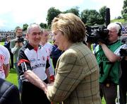 19 July 2009; President Mary McAleese shakes hands with Tyrone manager Mickey Harte before the game. GAA Football Ulster Senior Championship Final, Tyrone v Antrim, St Tighearnach's Park, Clones, Co. Monaghan. Picture credit: Oliver McVeigh / SPORTSFILE