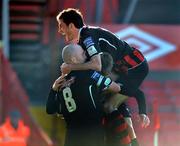 19 July 2009; Bohemians' Jason Byrne, hidden, celebrates after scoring his side's first goal with team-mates Paul Keegan, 8, and Killian Brennan. League of Ireland Premier Division, Bohemians v Derry City, Dalymount Park, Dublin. Picture credit: David Maher / SPORTSFILE