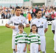 20 July 2009; Cristiano Ronaldo, left, and team-mate Fernando Gago, Real Madrid, with matchday mascots before the game. Soccer Friendly, Shamrock Rovers v Real Madrid, Tallaght Stadium, Dublin. Picture credit: David Maher / SPORTSFILE