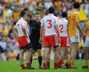 19 July 2009; Referee Padraig Hughes speaks to the players. GAA Football Ulster Senior Championship Final, Tyrone v Antrim, St Tighearnach's Park, Clones, Co. Monaghan. Picture credit: Brian Lawless / SPORTSFILE