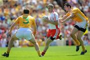 19 July 2009; Kevin Hughes, Tyrone, in action against Niall McKeever and Andy McClean, left, Antrim. GAA Football Ulster Senior Championship Final, Tyrone v Antrim, St Tighearnach's Park, Clones, Co. Monaghan. Picture credit: Brian Lawless / SPORTSFILE