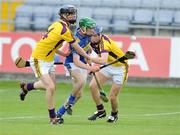 25 July 2009; David Butler, Tipperary, in action against Alan Nolan, 4, and Conor Goff, Wexford. ESB GAA Hurling All-Ireland Minor Championship Quarter-Final, Wexford v Tipperary, O'Moore Park, Portlaoise, Co. Laois. Picture credit: Matt Browne / SPORTSFILE
