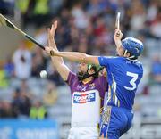 25 July 2009; James McInerney, Clare, in action against Stephen Banville, Wexford. GAA Hurling All-Ireland Senior Championship Relegation, Round 1, Clare v Wexford, O'Moore Park, Portlaoise, Co. Laois. Picture credit: Matt Browne / SPORTSFILE