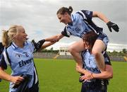 19 July 2009; Dublin players Denise Masterson, top, Lyndsey Peat, right, and Sorcha Furlong celebrate victory. TG4 Ladies Football Leinster Senior Championship Final, Dublin v Kildare, Dr. Cullen Park, Carlow. Picture credit: Pat Murphy / SPORTSFILE