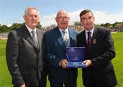 19 July 2009; Uachtarán Chumann Lúthchleas Gael Criostóir Ó Cuana, left, and Ulster GAA President Tom Daly, right, present Joe Lennon, Down, with a special 125 Celebrations momento of All Ireland Captains before the GAA Football Ulster Senior Championship Final, Tyrone v Antrim, St Tighearnach's Park, Clones, Co. Monaghan. Picture credit: Oliver McVeigh / SPORTSFILE
