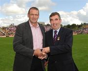 19 July 2009; Tyrone 1984 Jubilee Team member Patsy Kerlin receives a presentation from Ulster GAA President Tom Daly, right, at half time in the GAA Football Ulster Senior Championship Final, Tyrone v Antrim, St Tighearnach's Park, Clones, Co. Monaghan. Picture credit: Oliver McVeigh / SPORTSFILE