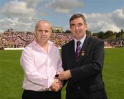 19 July 2009; Tyrone 1984 Jubilee Team member Paddy O'Neill receives a presentation from Ulster GAA President Tom Daly, right, at half time in the GAA Football Ulster Senior Championship Final, Tyrone v Antrim, St Tighearnach's Park, Clones, Co. Monaghan. Picture credit: Oliver McVeigh / SPORTSFILE