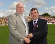 19 July 2009; Tyrone 1984 Jubilee Team member Audi Hamilton receives a presentation from Ulster GAA President Tom Daly, right, at half time in the GAA Football Ulster Senior Championship Final, Tyrone v Antrim, St Tighearnach's Park, Clones, Co. Monaghan. Picture credit: Oliver McVeigh / SPORTSFILE