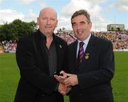 19 July 2009; Tyrone 1984 Jubilee Team member Ned Coyne receives a presentation from Ulster GAA President Tom Daly, right, at half time in the GAA Football Ulster Senior Championship Final, Tyrone v Antrim, St Tighearnach's Park, Clones, Co. Monaghan. Picture credit: Oliver McVeigh / SPORTSFILE