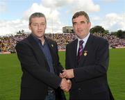 19 July 2009; Tyrone 1984 Jubilee Team member Stephen Coney receives a presentation from Ulster GAA President Tom Daly, right, at half time in the GAA Football Ulster Senior Championship Final, Tyrone v Antrim, St Tighearnach's Park, Clones, Co. Monaghan. Picture credit: Oliver McVeigh / SPORTSFILE
