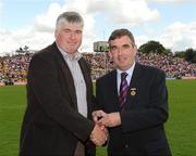 19 July 2009; Tyrone1984 Jubilee Team member Aidan O'Hagan receives a presentation from Ulster GAA President Tom Daly, right, at half time in the GAA Football Ulster Senior Championship Final, Tyrone v Antrim, St Tighearnach's Park, Clones, Co. Monaghan. Picture credit: Oliver McVeigh / SPORTSFILE