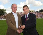 19 July 2009;Tyrone 1984 Jubilee Team member Gerry Taggart receives a presentation from Ulster GAA President Tom Daly, right, at half time in the GAA Football Ulster Senior Championship Final, Tyrone v Antrim, St Tighearnach's Park, Clones, Co. Monaghan. Picture credit: Oliver McVeigh / SPORTSFILE