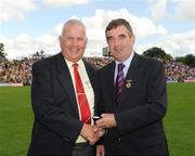 19 July 2009; Tyrone 1984 Jubilee Team member Pat McCartan receives a presentation from Ulster GAA President Tom Daly, right, at half time in the GAA Football Ulster Senior Championship Final, Tyrone v Antrim, St Tighearnach's Park, Clones, Co. Monaghan. Picture credit: Oliver McVeigh / SPORTSFILE