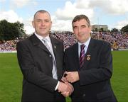 19 July 2009; Tyrone 1984 Jubilee Team member Paul Byrne receives a presentation from Ulster GAA President Tom Daly, right, at half time in the GAA Football Ulster Senior Championship Final, Tyrone v Antrim, St Tighearnach's Park, Clones, Co. Monaghan. Picture credit: Oliver McVeigh / SPORTSFILE