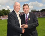 19 July 2009; Tyrone 1984 Jubilee Team member Tom McKeagney receives a presentation from Ulster GAA President Tom Daly, right, at half time in the GAA Football Ulster Senior Championship Final, Tyrone v Antrim, St Tighearnach's Park, Clones, Co. Monaghan. Picture credit: Oliver McVeigh / SPORTSFILE