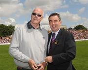 19 July 2009;Tyrone 1984 Jubilee Team member Art McRory receives a presentation from Ulster GAA President Tom Daly, right, at half time in the GAA Football Ulster Senior Championship Final, Tyrone v Antrim, St Tighearnach's Park, Clones, Co. Monaghan. Picture credit: Oliver McVeigh / SPORTSFILE