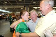 25 July 2009; Gold Medal winning European Youth Olympic athlete Ciara Mageean, left, with her grandfather Paddy Mason and her father Chris Mageean after her arrival at Dublin Airport, Dublin. Picture credit: Ray Lohan / SPORTSFILE