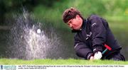 July 1997; Padraig Harrington playing from the water at the 13th green during the Murphy's Irish Open at Druid's Glen. Golf. Picture credit; David Maher/SPORTSFILE