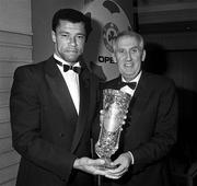 November 1991; Republic of Ireland's Paul McGrath receives the OPEL International Senior Player of the Year Award in 1991 from Arnold O'Byrne, Managing Director, OPEL Ireland in Dublin. Photo by Ray McManus/Sportsfile.