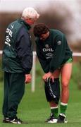 5 November 1996; Roy Keane changes his shorts   watched by team physio Mick Byrne during a Republic of Ireland Training Session at the AUL Sports Complex in Dublin. Photo by David Maher/Sportsfile