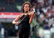 27 July 1997; Caroline Corr of the Irish band The Corrs performs during the half-time interval of the Budweiser American Bowl match between Pittsburgh Steelers and Chicago Bears at Croke Park in Dublin. Photo by Brendan Moran/Sportsfile