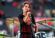 27 July 1997; Andrea Corr, lead singer of the Irish band The Corrs performs during the half-time interval of the Budweiser American Bowl match between Pittsburgh Steelers and Chicago Bears at Croke Park in Dublin. Photo by Brendan Moran/Sportsfile