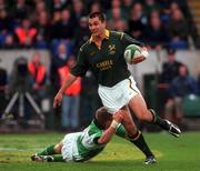 19 November 2000; Thinus Delport of South Africa in action against Ronan O'Gara of Ireland during the International rugby friendly match between Ireland and South Africa at Lansdowne Road in Dublin. Photo by Ray Lohan/Sportsfile