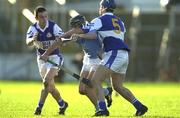 11 November 2000; Eddie O'Dwyer of Graigue-Ballycallan in action against John Hanlon, left, and Robert Delaney of Castletown during the AIB Leinster Senior Club Hurling Championship Semi-Final match between Graigue-Ballycallan and Castletown at Dr Cullen Park in Carlow. Photo by Ray McManus/Sportsfile