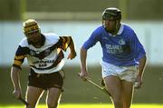 26 November 2000; Eddie Brennan of Graigue-Ballycallan, is tackled by Hugh Flannery of UCD, during the AIB Leinster Senior Hurling Championship Final between Graigue-Ballycallan and University College Dublin at Nowlan Park in Kilkenny. Photo by Ray McManus/Sportsfile