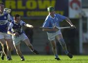 11 November 2000; Eddie O'Dwyer of Graigue-Ballycallan, right, during the AIB Leinster Senior Club Hurling Championship Semi-Final match between Graigue-Ballycallan and Castletown at Dr Cullen Park in Carlow. Photo by Ray McManus/Sportsfile
