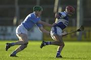 11 November 2000; Fionan O'Sullivan of Castletown in action against Eddie O'Dwyer of Graigue-Ballycallan during the AIB Leinster Senior Club Hurling Championship Semi-Final match between Graigue-Ballycallan and Castletown at Dr Cullen Park in Carlow. Photo by Ray McManus/Sportsfile