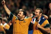 6 November 1999; Australia's Michael Foley, left, and Richard Harry, celebrate following the Rugby World Cup Final match between Australia and France at the Millenium Stadium in Cardiff, Wales. Photo by Matt Browne/Sportsfile
