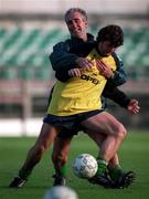 9 November 1996; Republic of Ireland manager Mick McCarthy, behind, tackles Roy Keane during a Republic of Ireland training session at Lansdowne Road in Dublin. Photo by Ray McManus/Sportsfile
