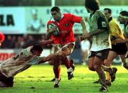 13 December 1998;  Tom Tierney of Munster is tackled by Bernard Giusti of Colomiers during the Heineken Cup Quarter-Final match between, Munster and Colomiers at Stade Toulouse in Toulouse, France. Photo by Matt Browne/ Sportsfile