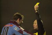 5 January 2001; Referee John Stacey shows Trevor Vaughan of Drogheda United a yellow card during the FAI Harp Lager Cup Second Round match between Bohemians and Drogheda United at Dalymount Park in Dublin. Photo by David Maher/Sportsfile