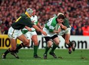 19 November 2000; Brian O'Driscoll of Ireland in action against Albert Van Den Berg of South Africa during the International rugby friendly match between Ireland and South Africa at Lansdowne Road in Dublin. Photo by Matt Browne/Sportsfile