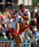13 May 2000; Richard Thornton of Tyrone, right, celebrates a goal with team-mate Owen Mulligan during the All-Ireland U21 Football Championship Final between Tyrone and Limerick at Cusack Park in Mullingar, Westmeath.  Photo by Ray McManus/Sportsfile