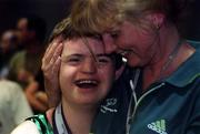 2 July 1999; Adam Morrison from Newtownards, Down who won six medals, one Gold, two Silver and three Bronze is congratulated by Gymnastics Head Coach Sinéad Byrne after the presentation of medals at the 1999 Special Olympics World Summer Games in Raleigh, North Carolina, USA. Photo by Ray McManus/Sportsfile