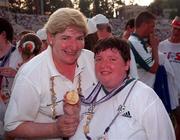 4 July 1999; Special Olympian Catherine Roche from Palatine, Carlow, who won a Gold medal in Table Tennis with Eileen Brophy, who acted as a chaperone to the Athletic team at the Closing Ceremony of the 1999 Special Olympics World Summer Games in Raleigh, North Carolina, USA. Photo by Ray McManus/Sportsfile