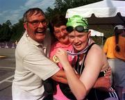 30 June 1999; Caitriona Ryan from Rathlee,  Sligo and her parents Eugene and Anna with Caitriona's Gold medal after winning the 25 meters Freestyle during the 1999 Special Olympics World Summer Games in Raleigh, North Carolina, USA. Photo by Ray McManus/Sportsfile
