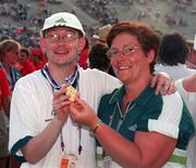 4 July 1999; John Blackburn from Newtown, Wexford, who won a Gold Medal in the Shot Put with Special Olympic Co-ordinator Annet Codd at the Closing Ceremony of the 1999 Special Olympics World Summer Games in Raleigh, North Carolina, USA. Photo by Ray McManus/Sportsfile
