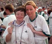 4 July 1999; Special Olympian Margaret Conneran from Galway who won a Silver medal in Bowling with Basketball coach Patricia Lee at the Closing Ceremony of the1999 Special Olympics World Summer Games in Raleigh, North Carolina, USA. Photo by Ray McManus/Sportsfile