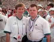 4 July 1999; Special Olympian Mark Smith from Maynooth, Kildare who won a Silver medal in swimming with table tennis coach Anna Byrne at the Closing Ceremony of the 1999 Special Olympics World Summer Games in Raleigh, North Carolina, USA. Photo by Ray McManus/Sportsfile