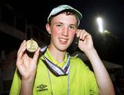 29 June 1999; Padraig Howard of Special Olympics Ireland, from Ballina, Co Mayo, phones home with the news that he had won a Gold medal in the Shot Put Final at the 1999 Special Olympics World Summer Games in Raleigh, North Carolina, USA. Photo by Ray McManus/Sportsfile